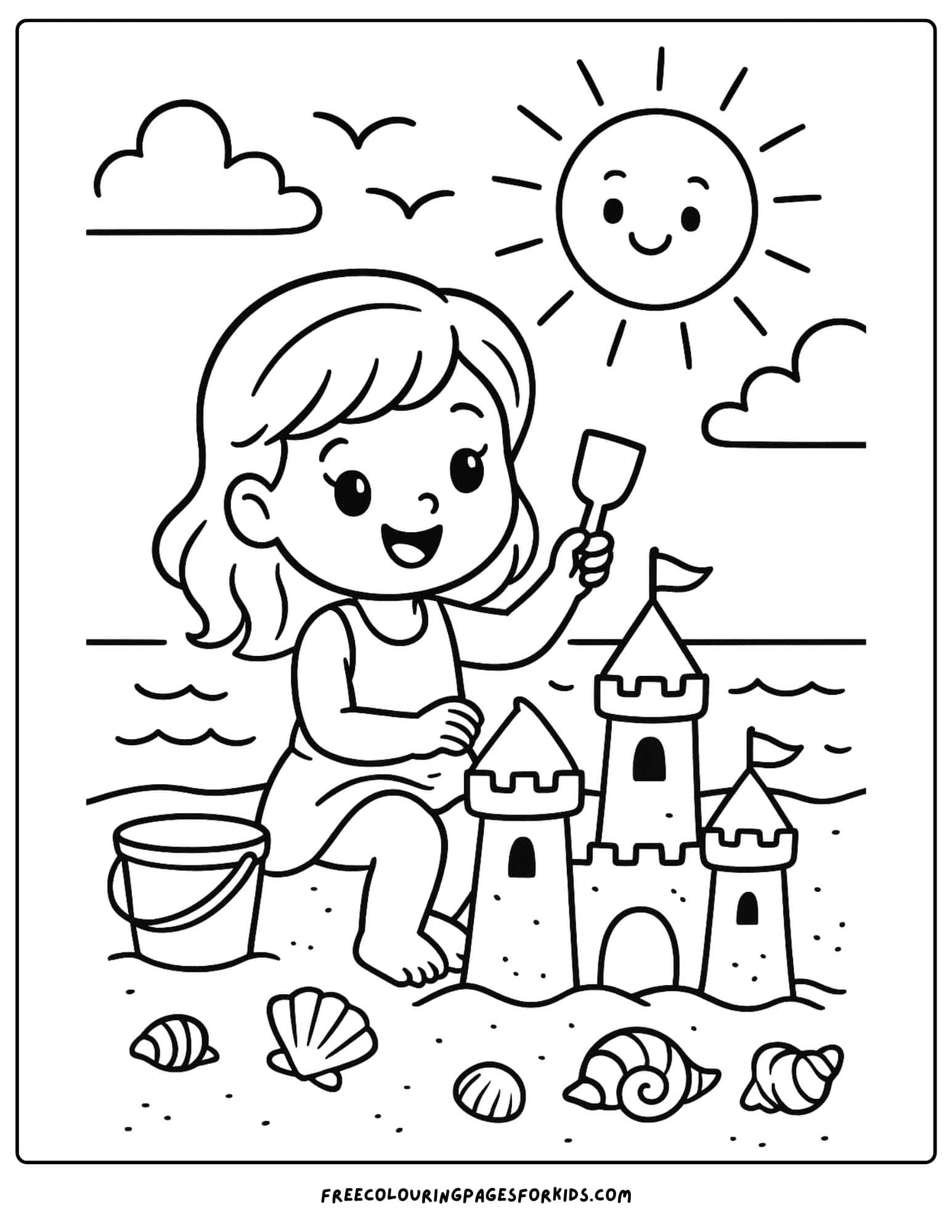 a girl building a sandcastle at the beach