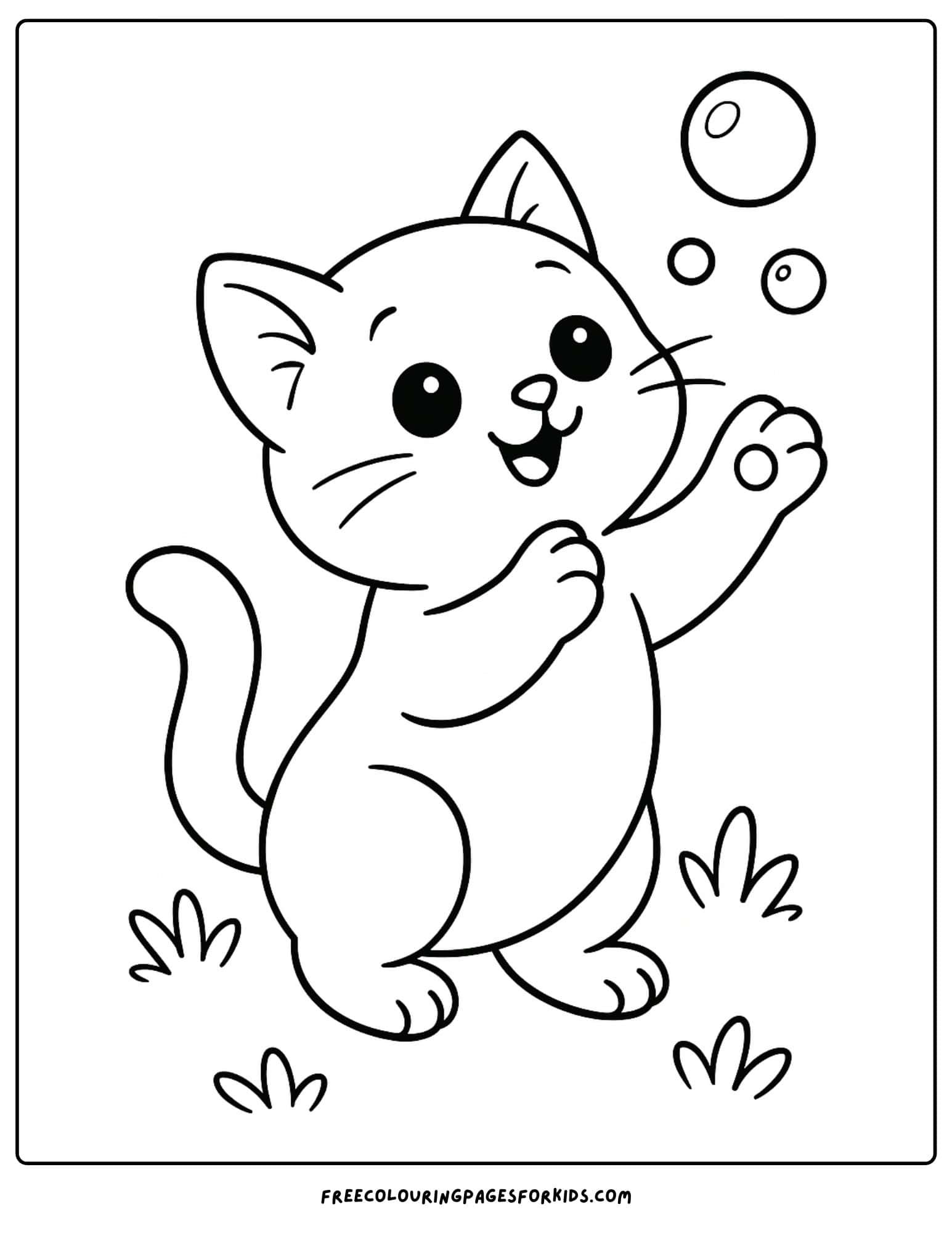 a kitten catching bubbles