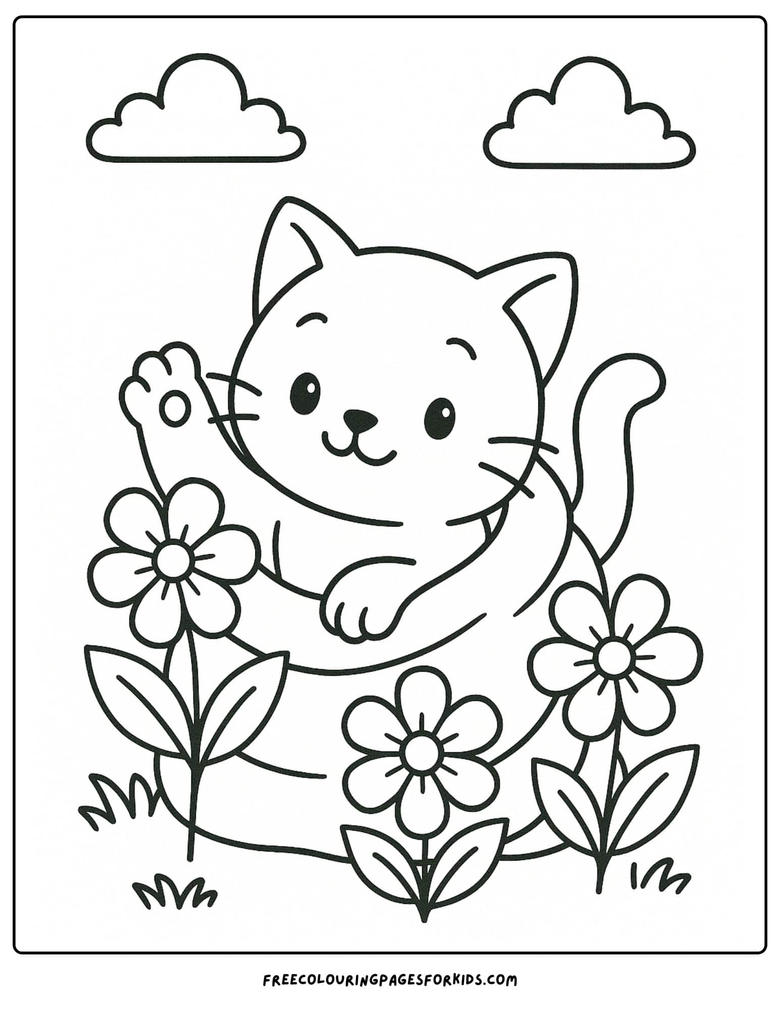 a kitten hiding behind flowers